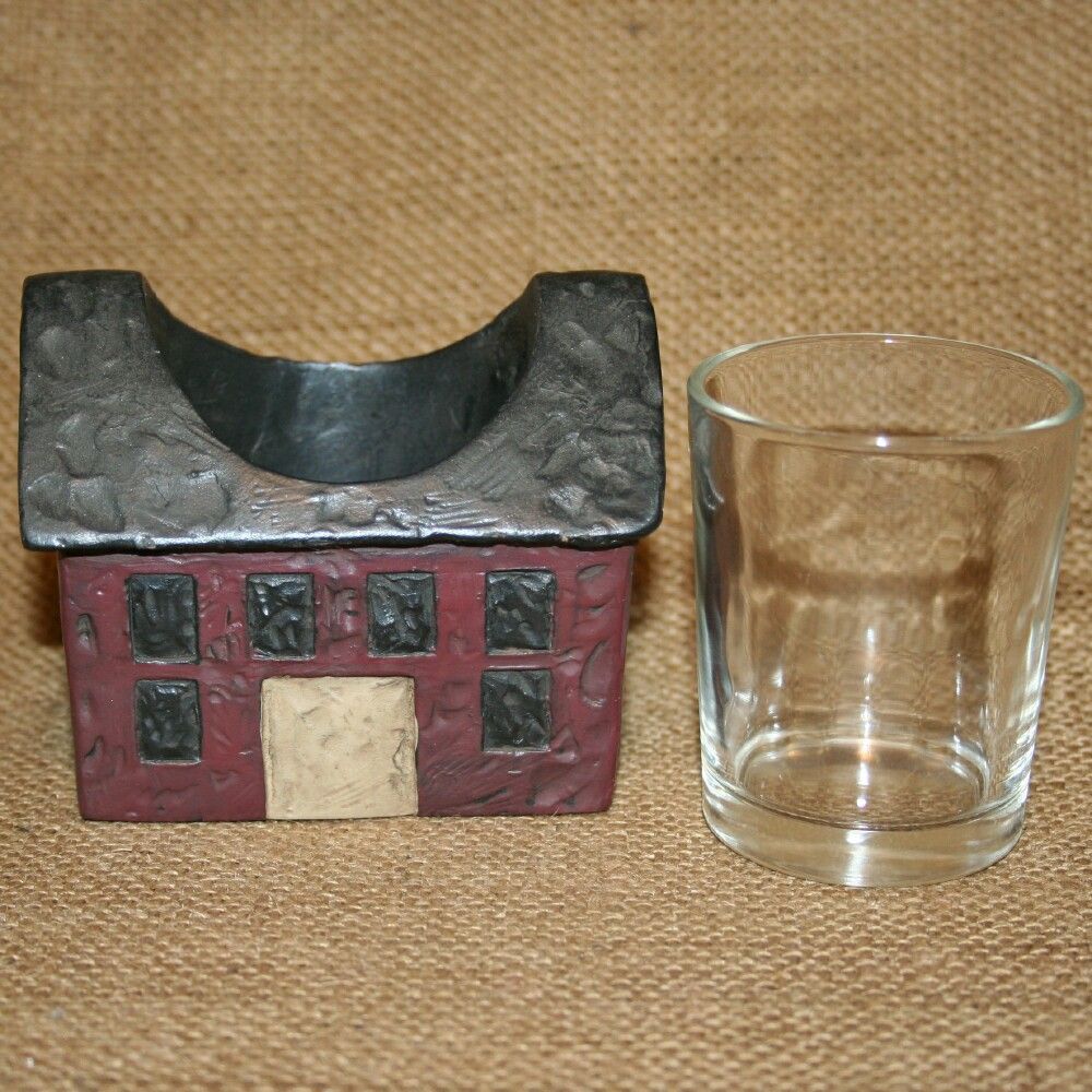 This votive candle holder is 3 inches tall by 3 5/8 inches wide by 2 5 