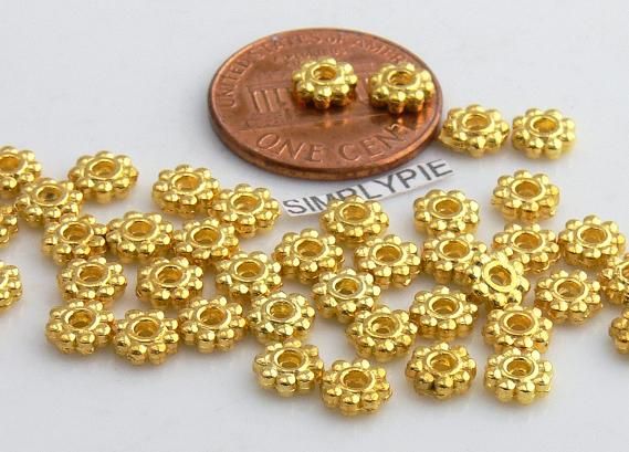Beautiful gold plated metal daisy spacer beads. Please check our
